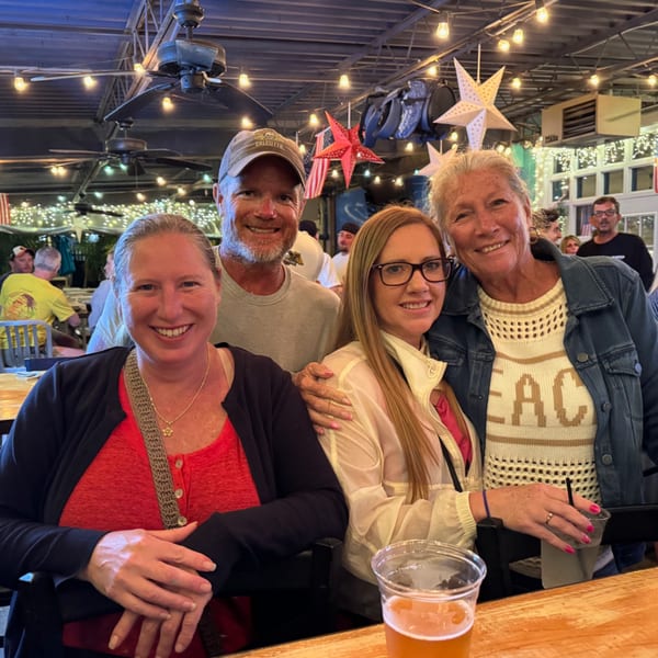 Four smiling people pose for a photo at The Salted Rim Margarita Bar & Grille.