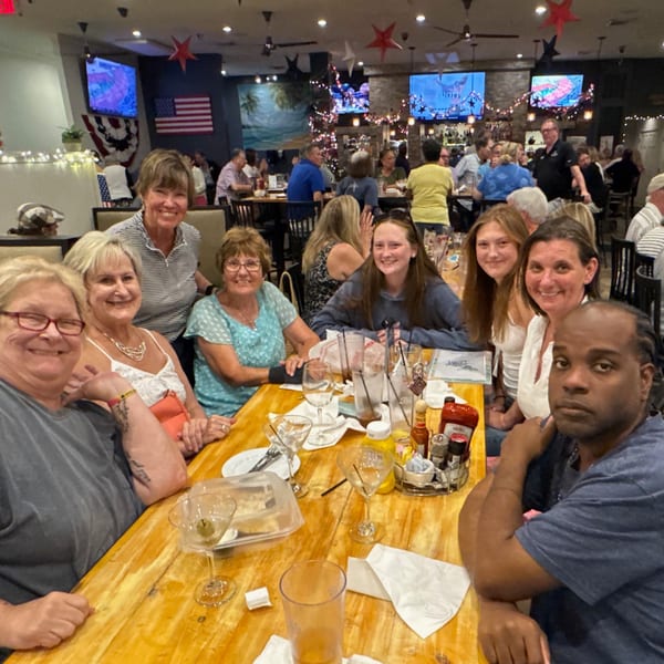 A group of happy customers enjoying drinks and food at The Salted Rim Margarita Bar & Grille.