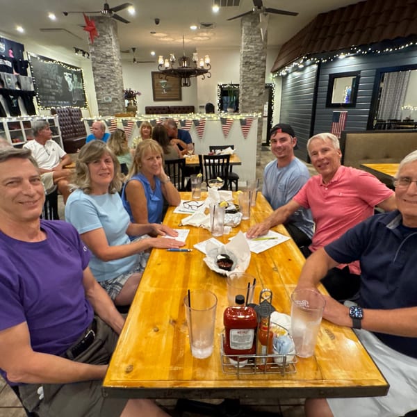 Group of friends enjoying a meal together at The Salted Rim Margarita Bar & Grille.