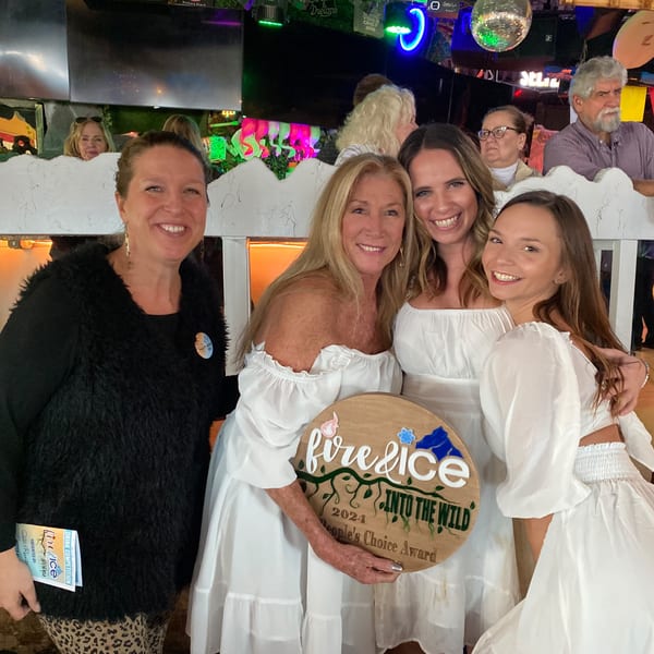 Four women smiling, holding a "Fire & Ice People's Choice Award" plaque at The Salted Rim.