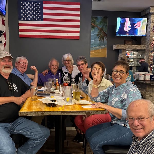 Group of happy diners enjoying a meal at The Salted Rim Margarita Bar & Grille.